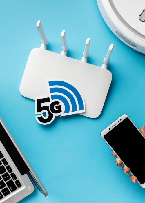 top-view-wi-fi-router-with-laptop-vacuum-cleaner_compressed-scaled